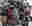 Samantha Johnston - Studio Wall Contact Sheets Image shows a studio wall filled with darkroom printed contact sheets. They are crowded together, overlapping other pages. All the images on the contact sheets are in colour, lots of bright reds and blues being the most prominent.